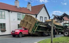 Tractor trailer overturns onto parked cars in East Yorkshire village