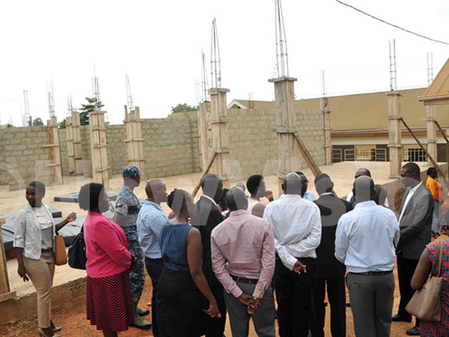  r twine and other ministry officials inspecting one of the building which under construction hoto by enry subuga