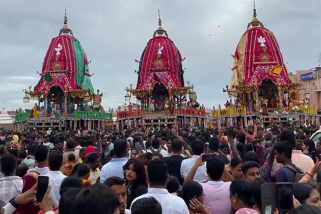 Devotees witness Lord Jagannath, Balabhadra and Subhadra during 'Adhara Panna' ritual in Puri