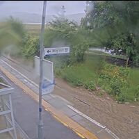 Torrential rain floods Scots roads as driver stranded and rail lines hit by closures