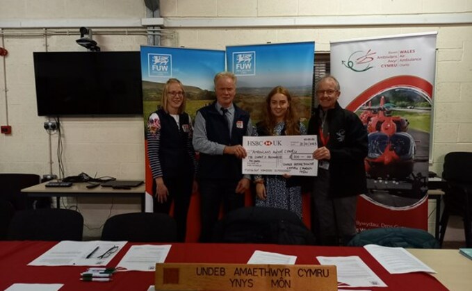 FUW Anglesey County executive officer Alaw Jones, FUW Anglesey County Chair William Hughes, FUW Anglesey Deputy County Executive Officer Alys Roberts and Wales Air Ambulance Community Fundraiser Alwyn Jones.