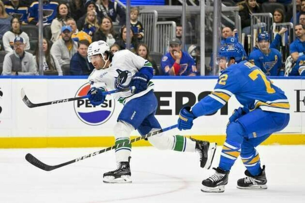 Kiefer Sherwood nets hat trick as Canucks edge Blues in shootout