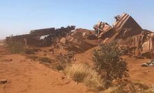 The wreckage of the derailed BHP train