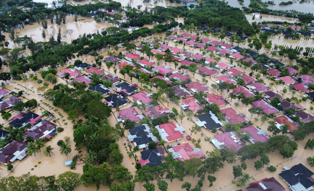 Aceh Utara, Indonesia - 26 November 2025 : aerial view of the flooded PT Pupuk Iskandar Muda complex