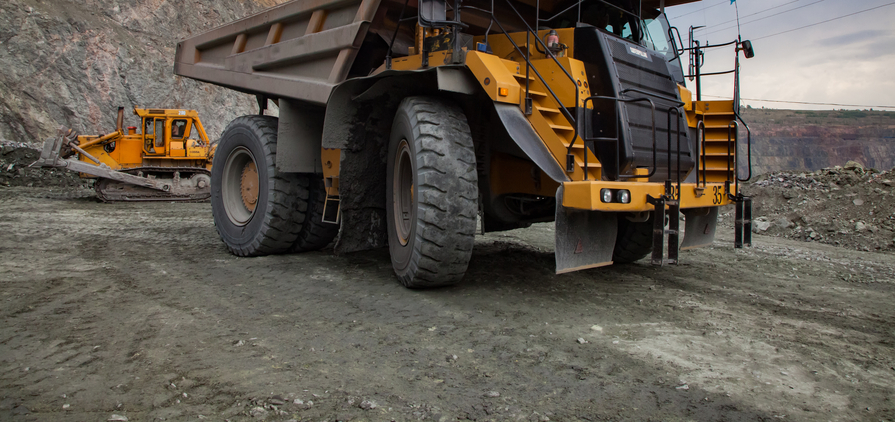 Caterpillar quarry truck transporting iron ore in Kazakhstan
