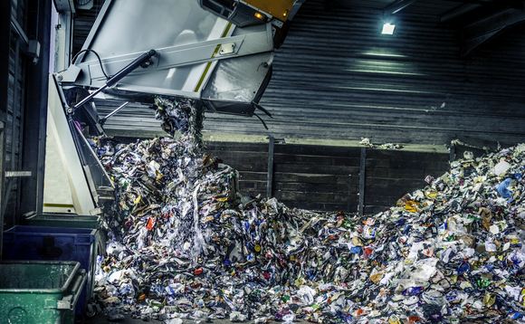Tipping recycling into a storage shed from a refuse collection lorry | Credit: iStock