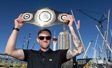 Tom March celebrates on stage