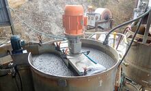 An operating float cell with pyrite collected in the froth at the top of the cell.