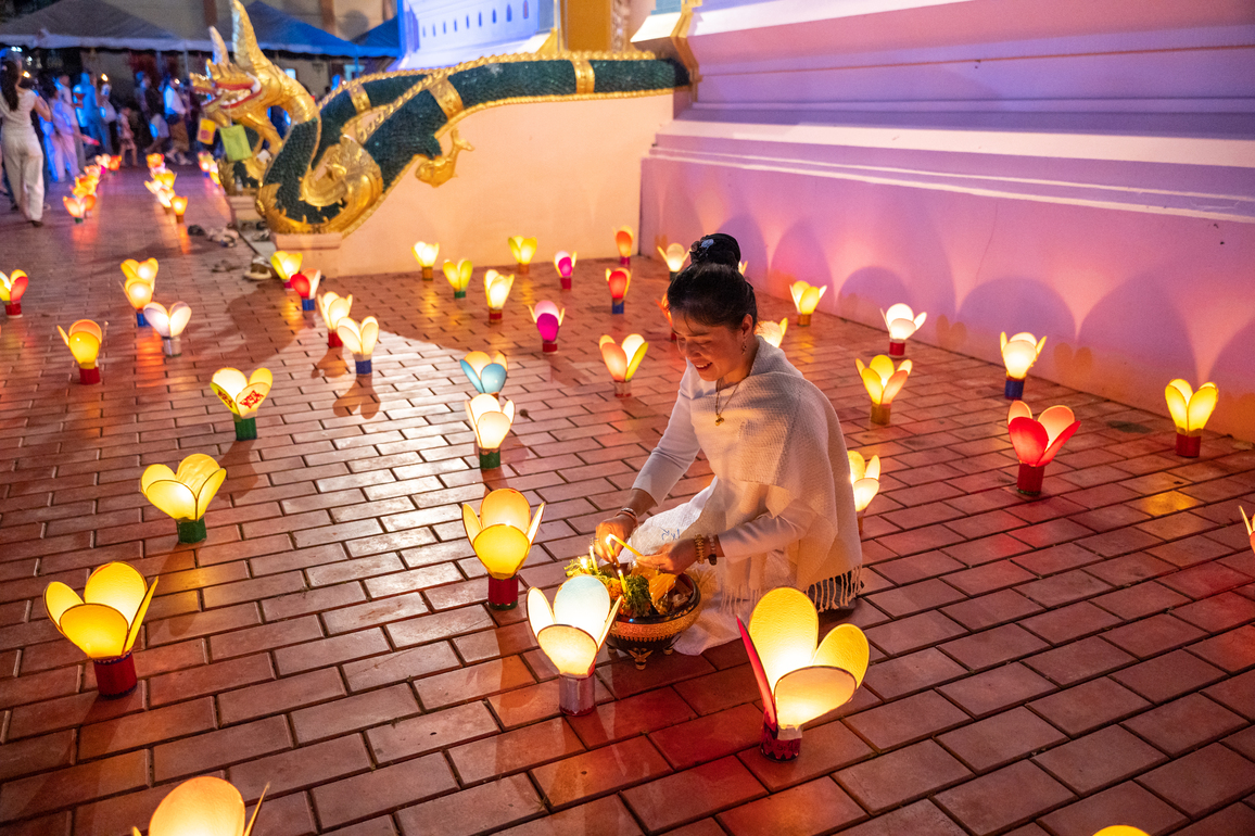 Joy, color shine bright in Laos celebrating end of Buddhist Lent, boat racing festival