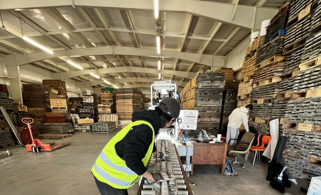 Two technicians from Scient digitising almost 1000m of core per day at the Nova Scotia Core Storage Facility in Stellarton