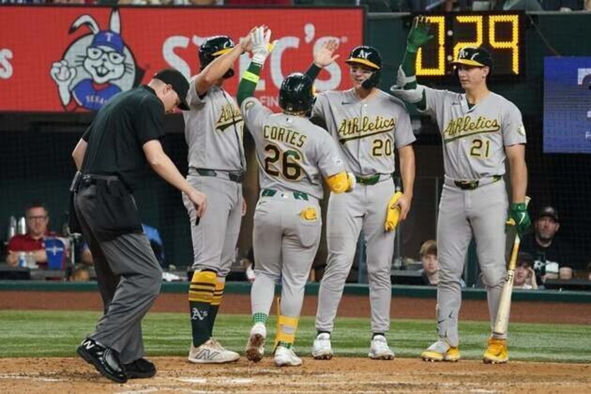 Athletics' 5 home runs bury Rangers