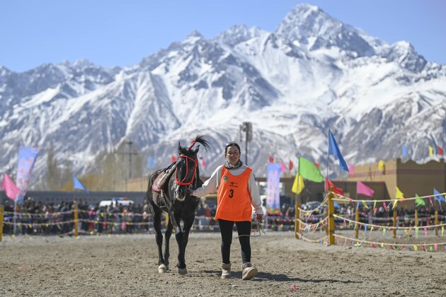 In Pics: Female rider gallops across the Pamir