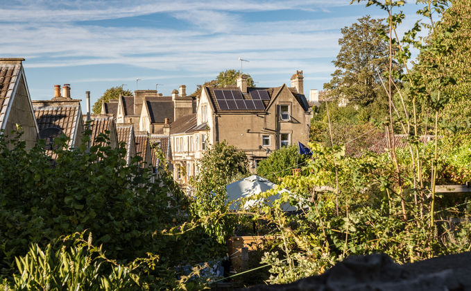 Solar panels on buildings in Bath, England | Credit: iStock