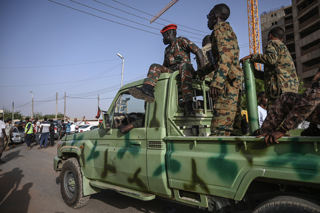  embers of the udanese military sat atop a pickup as protesters rallied outside the army headquarters in hartoum 