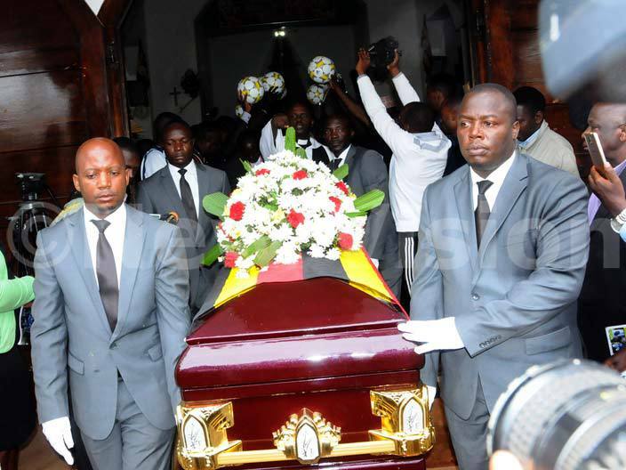 all bearers prepare hairas casket for public viewing of the body outside ll aints athedral