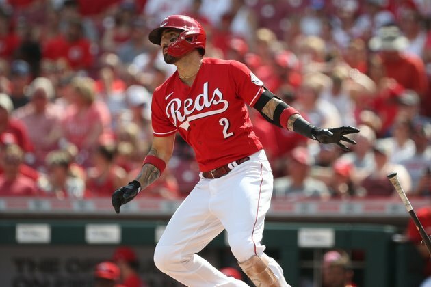 Reds continue Rockies' road woes in 10-3 victory