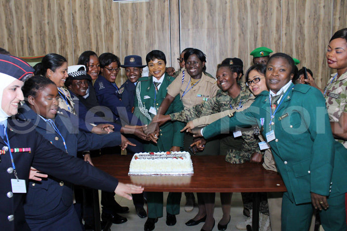  ome of the 39 army and police women officers from 17 countries cut cake during their graduation ceremony
