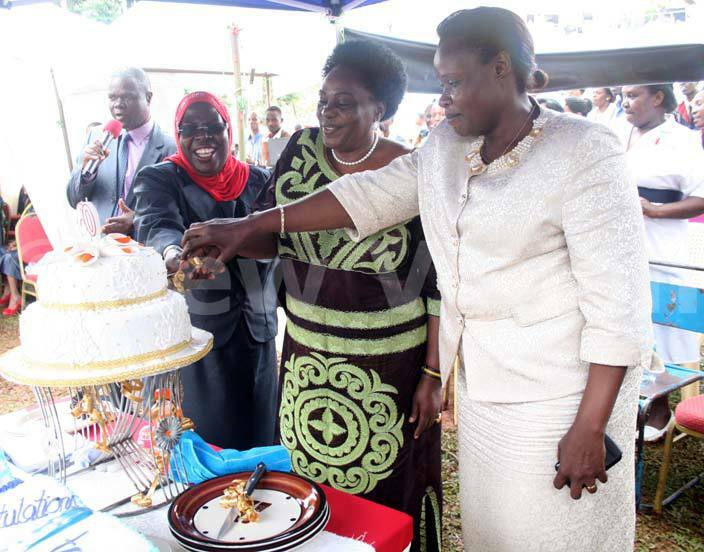  rom  rincipal ulago chool of ursing and idwifery afina usene inister for ecurity arooro kurut and ducation inister essica lupo cut the cake during the 7th graduation ceremony of ulago chool of ursing and idwifery hoto y yet kwera