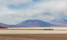  FCAB ore train crossing the Ascotán salt flat at the mine