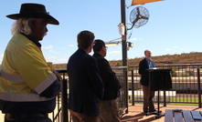  Banjima Traditional Owner Maitland Parker, South Flank project director Simon Thomas and BHP iron ore asset president Edgar Basto listening to Western Australian mines minister Bill Johnston at the opening of a village at South Flank in August 2019. Photo by Karma Barndon.