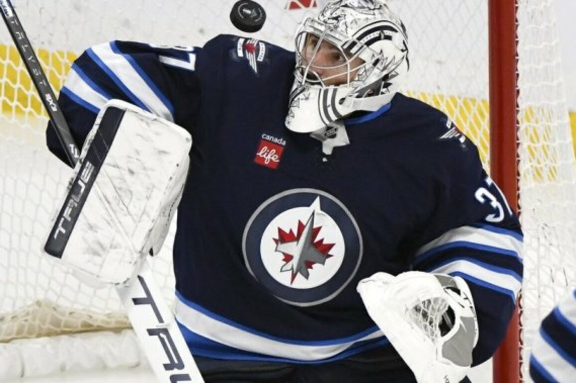 Shocked Jets goalie Connor Hellebuyck wins both Hart, Vezina trophies