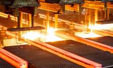 Hot steel on conveyor in steel mill. Image: iStock.com/zhaojiankang