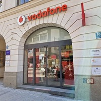 Vodafone upgrades forecast, boosts dividend after merger lift