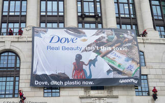 'Trashing the planet': Greenpeace barricades Unilever HQ in protest at firm's plastic output