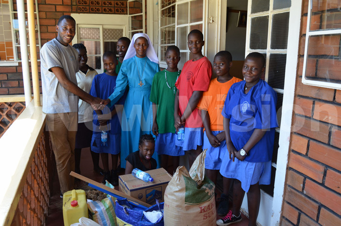  he students with r ary ildred after handing over the food items they donated to the elderly persons home