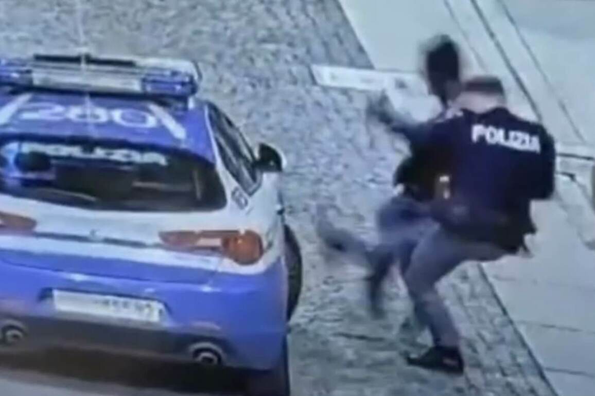 Moment swaggering robbery suspect is brutally taken down by cop after punching police car