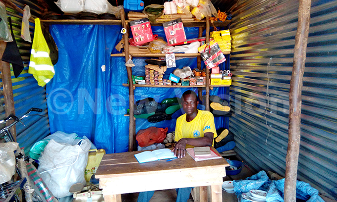  andera waits for customers at his hardware shop in the gold mining camp in ukuya hoto by illy wothungeyo