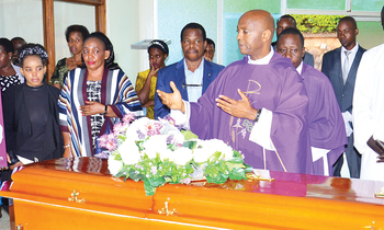 Fr. Mungereza ng’asabira omwoyo gw’omugenzi e Mbuya. Fr. Mungereza ng’asabira omwoyo gw’omugenzi e Mbuya.