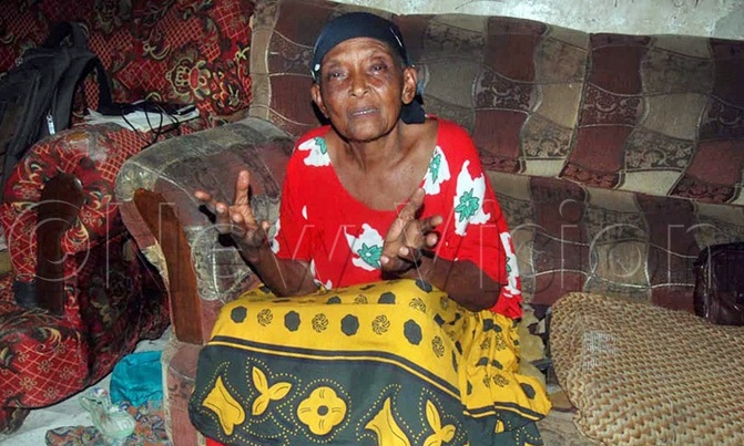 Elderly woman reminisces old days with Ggwanga Elderly woman reminisces old days with Ggwanga