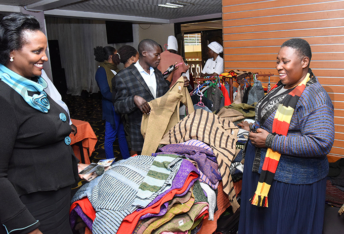 residential dvisor usan uhwezi admiring some of the  fabrics exhibited hoto by palanyi sentongo