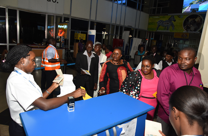 he farmers check in at ntebbe irport for their flight hoto by ichard anya
