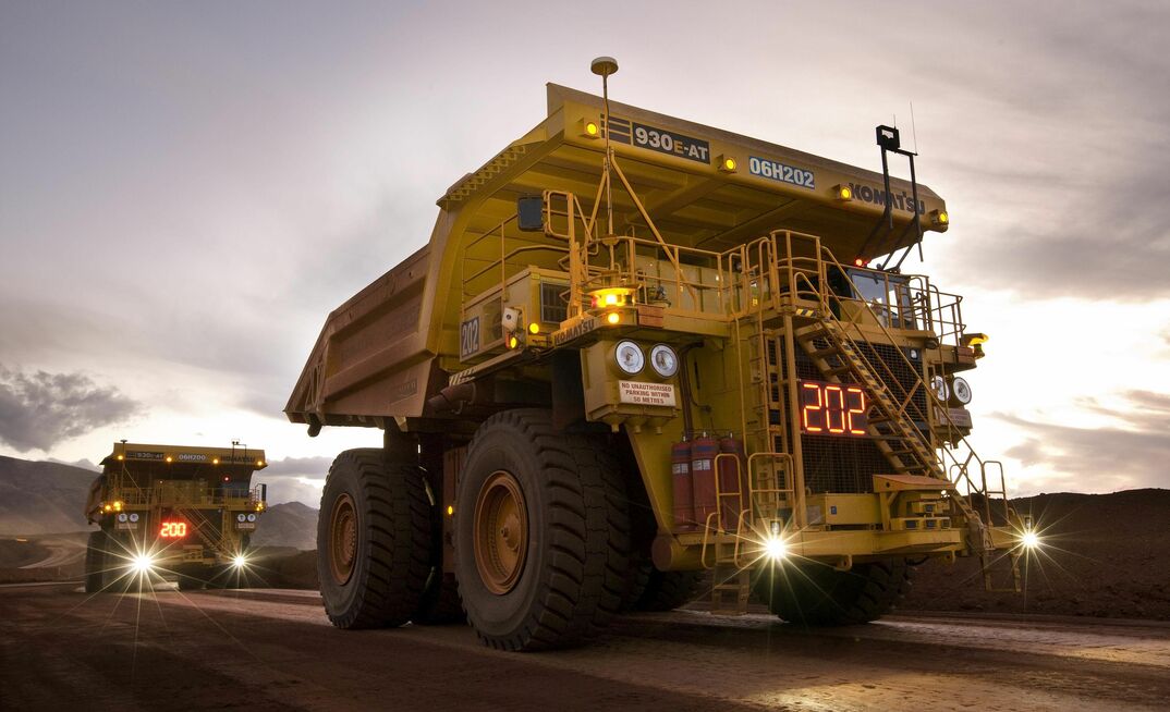 Autonomous Komatsu trucks at a Rio Tinto mine.