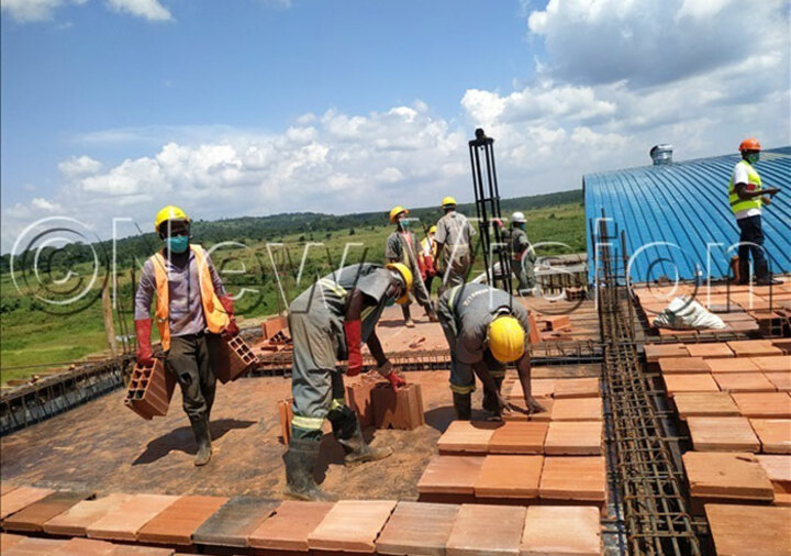 Workers setting up the top floor of the start-up facilities building expected to be an office section. Photo by Ruth Nasejje.
