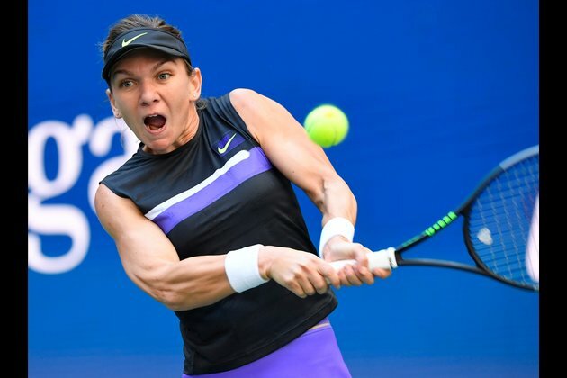 Top-seeded Halep survives tough Rome opener