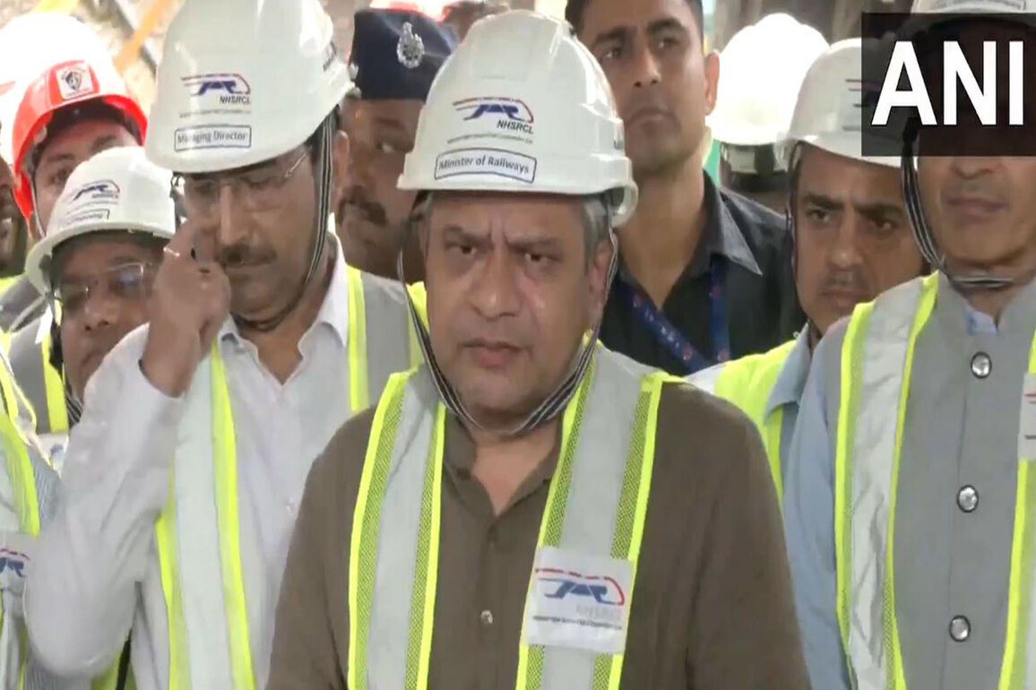 Railway Minister Ashwini Vaishnaw interacts with workers after Mumbai-Ahmedabad bullet train tunnel breakthrough