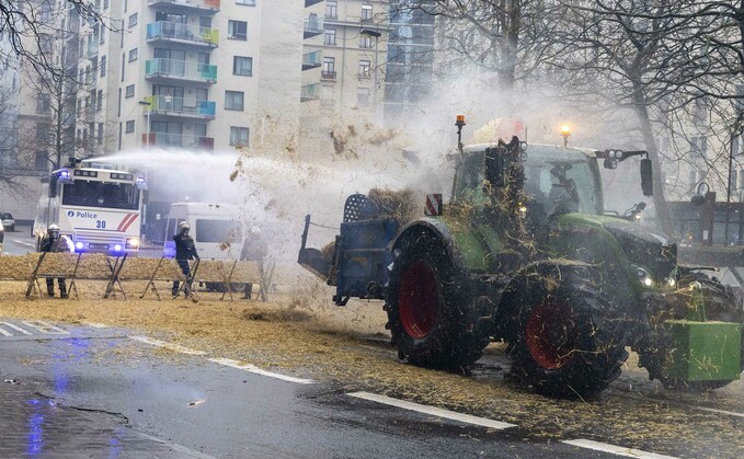Riot police in Belgium employ water cannons after farmer protests escalated