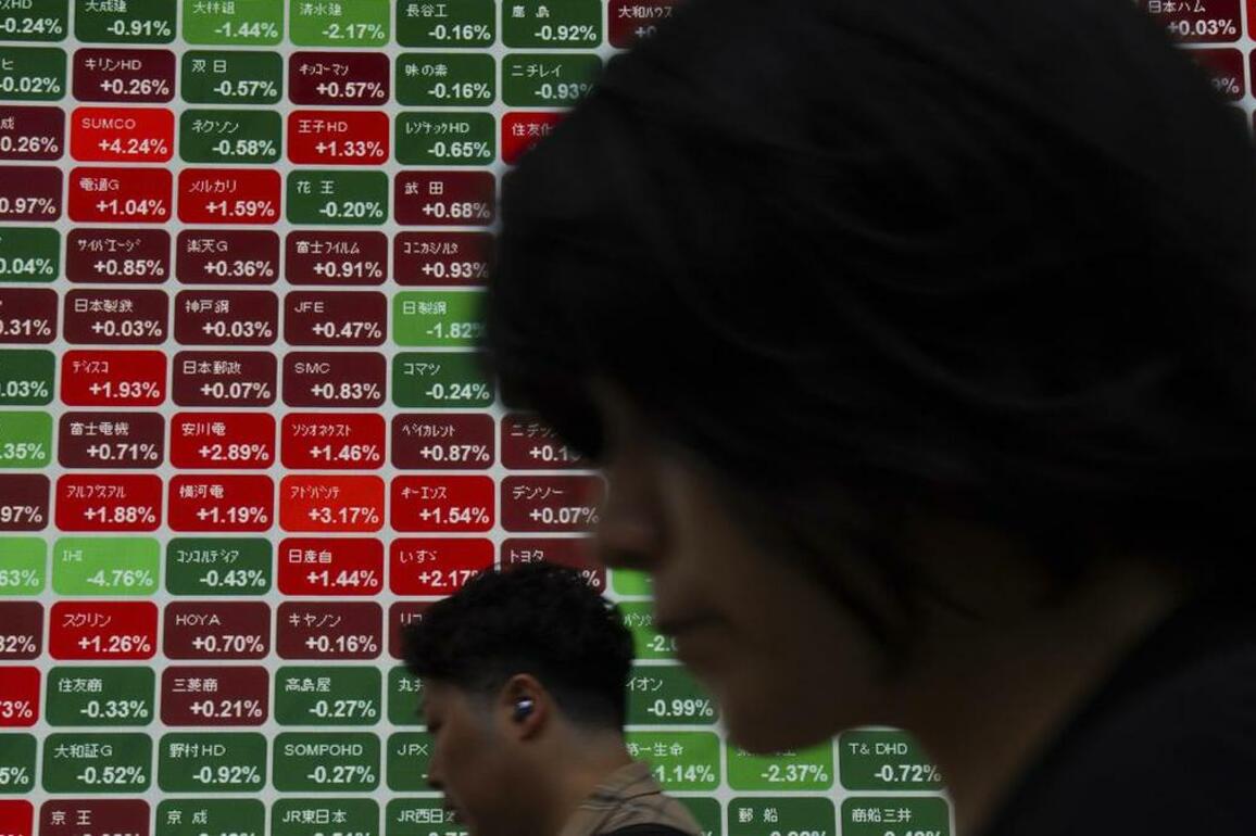 Stocks, dollar stay calm in Asia as oil rises