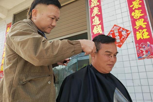 Tiny mobile barbershop brings free services, warmth to rural elderly