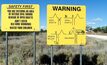 Signs warning of the dangers at Lightning Ridge.