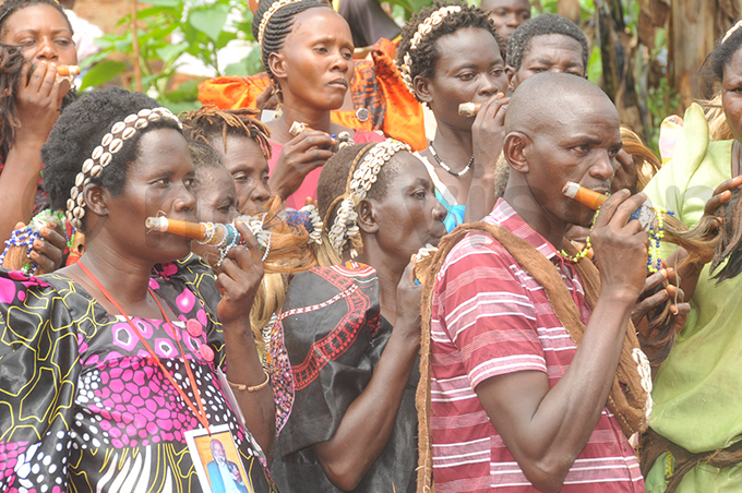 baswezi blowing their flutes during the ceremony on unday hoto by onald iirya