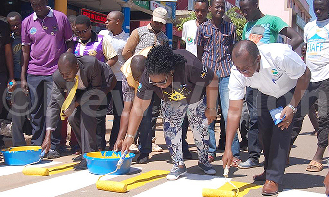 National Housing Boss, Mayor Kakyebezi paint Zebra Crossings to reduce accidents National Housing Boss, Mayor Kakyebezi paint Zebra Crossings to reduce accidents