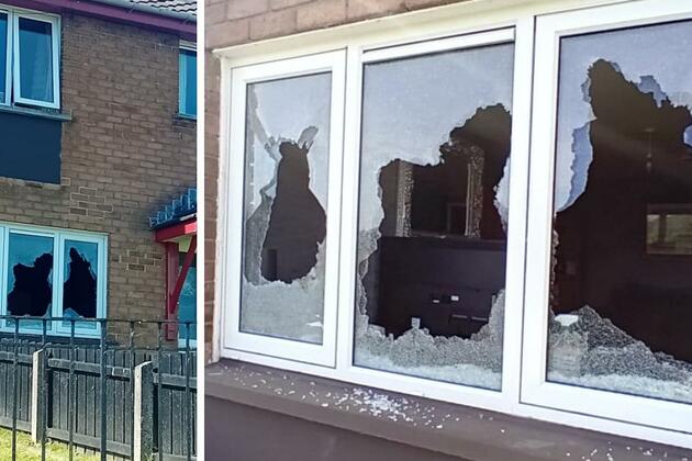 Masked men smash windows and throw fireworks into house
