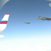 US F-22 fighter jets escort Putins plane