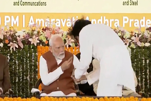 PM Modi gives chocolate to Andhra Deputy CM Pawan Kalyan in Amravati