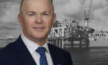 Santos presses for Barossa cashflow. Pictured: Santos CEO Kevin Gallagher alongside the Barossa oil and gas production platform.