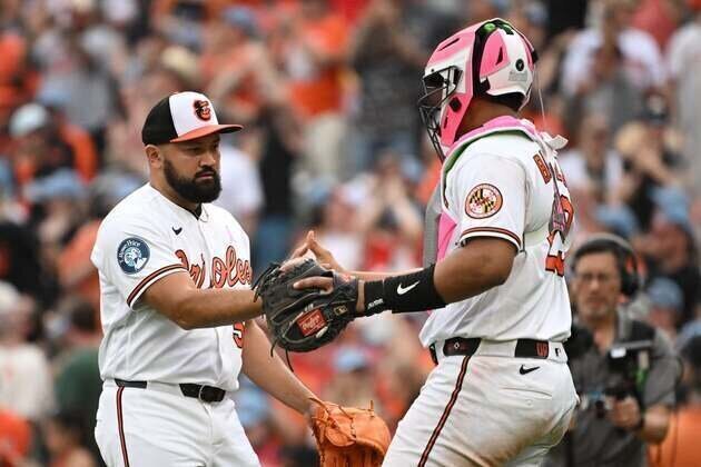 Orioles spin 4-hitter to salvage finale against A's